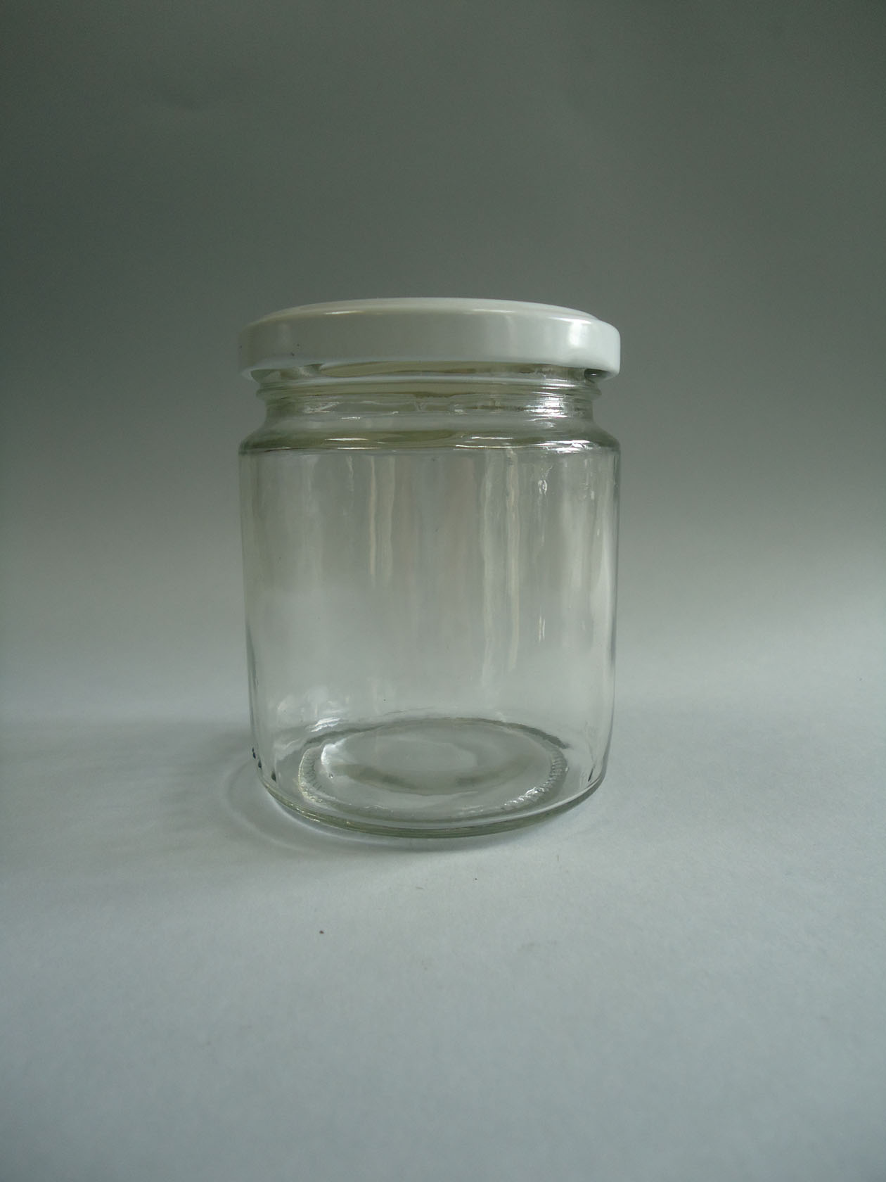 Bote vidrio tapa metálica blanca twist  250 ml. (caja 100 uni.)
